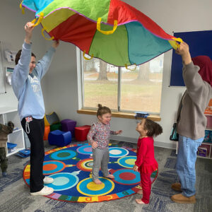 parachute fun in Bounce ABA Preschool of Essex Junction, Vermont